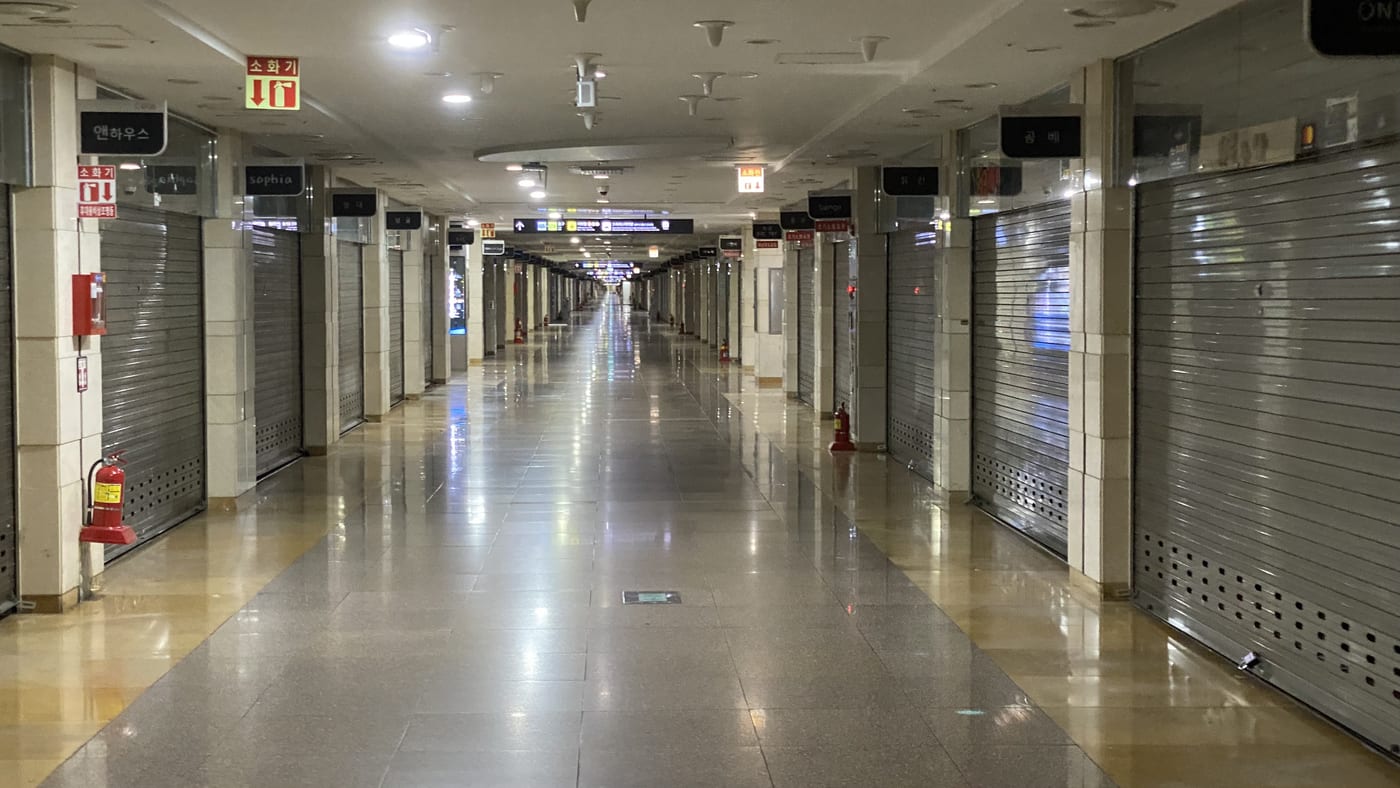Rows of clothing shops inside Goto Mall, the underground arcade at Seoul's Express Bus Terminal Station.