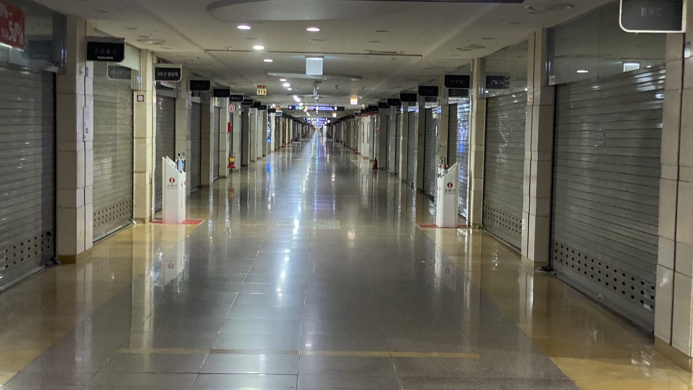 The Goto Mall underground corridor at Express Bus Terminal Station in Seoul, lined with clothing shops.